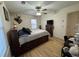 A bedroom featuring a wooden bed frame with built-in storage drawers and hardwood flooring at 260 Carolina Cir, Walterboro, SC 29488