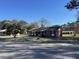 Quaint brick home showcases its classic architecture and peaceful surroundings against a clear blue sky at 260 Carolina Cir, Walterboro, SC 29488