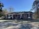 Cozy brick home featuring classic shutters, a welcoming front porch, and a well-maintained front yard at 260 Carolina Cir, Walterboro, SC 29488