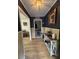 Inviting hallway featuring elegant decor, hardwood floors, and charming decorative touches at 260 Carolina Cir, Walterboro, SC 29488