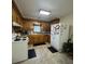 Functional kitchen with wooden cabinets, essential appliances, and a bright, airy feel at 260 Carolina Cir, Walterboro, SC 29488