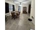 Open concept living area with dining table and views of laundry connections and antique hutch at 260 Carolina Cir, Walterboro, SC 29488