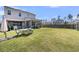 Expansive backyard featuring a dining area, bar, and screened porch for ultimate outdoor enjoyment at 271 Palmetto Walk Dr, Summerville, SC 29486