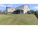 Large backyard with a screened porch, offering plenty of space for outdoor living and recreation at 271 Palmetto Walk Dr, Summerville, SC 29486