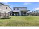 Spacious backyard featuring bar, screened porch and ample room for outdoor activities and entertaining at 271 Palmetto Walk Dr, Summerville, SC 29486