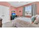 Cozy bedroom with pink walls, natural light from a large window, and plush bedding at 271 Palmetto Walk Dr, Summerville, SC 29486