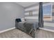 Charming bedroom with serene blue color scheme, window views, and comfortable furnishings at 271 Palmetto Walk Dr, Summerville, SC 29486