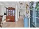 View of home's entryway with hardwood floors, decorative mirror and hutch, leading into the house at 271 Palmetto Walk Dr, Summerville, SC 29486