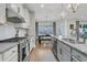 Well-designed kitchen with granite countertops, stainless appliances, and views into the dining area at 271 Palmetto Walk Dr, Summerville, SC 29486