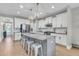 Open kitchen with stainless steel appliances, a granite island, and light hardwood flooring at 271 Palmetto Walk Dr, Summerville, SC 29486
