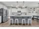 Bright kitchen featuring a large island with granite countertops and stainless steel appliances at 271 Palmetto Walk Dr, Summerville, SC 29486