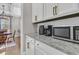 Kitchen countertop featuring granite surfaces and white cabinets, plus a coffee and microwave station at 271 Palmetto Walk Dr, Summerville, SC 29486