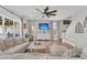 Spacious living room with large sectional couch, open windows and view of the staircase at 271 Palmetto Walk Dr, Summerville, SC 29486