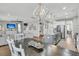 Open living space featuring a modern kitchen and a cozy living area with a large window at 271 Palmetto Walk Dr, Summerville, SC 29486