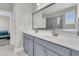 Elegant bathroom with dual sinks, gray cabinetry, and a glass enclosed shower at 271 Palmetto Walk Dr, Summerville, SC 29486