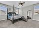 Spacious main bedroom with a four poster bed, ceiling fan, and natural light at 271 Palmetto Walk Dr, Summerville, SC 29486