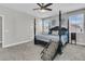 Spacious main bedroom with a four poster bed, ceiling fan, and natural light at 271 Palmetto Walk Dr, Summerville, SC 29486