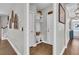 Hallway with mud room featuring storage cubbies, hooks, and ample space, leading to front door at 271 Palmetto Walk Dr, Summerville, SC 29486