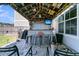 Well-equipped outdoor bar with seating, grill, and TV, perfect for entertaining guests at 271 Palmetto Walk Dr, Summerville, SC 29486