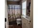 Bathroom featuring neutral colors, white vanity, and shower with a beach themed curtain at 2729 Barracada Rd, Walterboro, SC 29488
