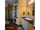 Bathroom featuring tiled countertops, a sink, and plenty of shelving at 2729 Barracada Rd, Walterboro, SC 29488