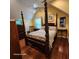 Bedroom featuring a four poster bed frame, natural lighting, and hardwood flooring at 2729 Barracada Rd, Walterboro, SC 29488