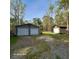View of 2 metal garages and one wood garage at 2729 Barracada Rd, Walterboro, SC 29488