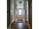 Hallway with hardwood floors and natural light provides a bright, welcoming feel at 2729 Barracada Rd, Walterboro, SC 29488