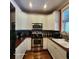 Bright kitchen with stainless steel appliances and white cabinets at 2729 Barracada Rd, Walterboro, SC 29488
