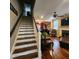 Beautiful staircase leading to a spacious living room with a fireplace at 2729 Barracada Rd, Walterboro, SC 29488