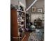 Comfortable living area with hardwood floors and plenty of shelving for storage and display at 2729 Barracada Rd, Walterboro, SC 29488