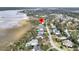 Aerial view of waterfront homes, showcasing community layout and proximity to a waterway at 2777 Oak Manor Dr, Mount Pleasant, SC 29466
