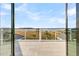 Gorgeous balcony view of the marsh with a glass railing and large sliding doors at 2777 Oak Manor Dr, Mount Pleasant, SC 29466