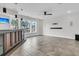 Spacious room with a bar and large windows overlooking a scenic view of palm trees and the waterfront at 2777 Oak Manor Dr, Mount Pleasant, SC 29466