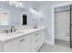 Bright bathroom with dual sinks, white cabinetry, and a glass-enclosed shower at 2777 Oak Manor Dr, Mount Pleasant, SC 29466