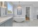Bathroom showcasing soaking tub, vanity, chandelier, and elegant decor at 2777 Oak Manor Dr, Mount Pleasant, SC 29466