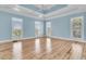 Bright bedroom with natural light showcases wood floors, and a trey ceiling at 2777 Oak Manor Dr, Mount Pleasant, SC 29466