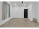 Bright, empty room with tiled floors, a window with curtain, and neutral paint at 2777 Oak Manor Dr, Mount Pleasant, SC 29466
