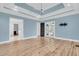 Spacious bedroom boasts ensuite bathroom access, light blue walls, and wood floors at 2777 Oak Manor Dr, Mount Pleasant, SC 29466