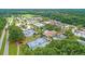 Aerial view of active tennis courts and community center surrounded by lush greenery at 2777 Oak Manor Dr, Mount Pleasant, SC 29466