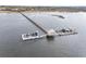 View of a private dock with multiple boat slips, boat house, and a long pier extending into the waterway at 2777 Oak Manor Dr, Mount Pleasant, SC 29466