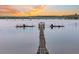 Picturesque dock with boat lifts offering stunning sunset views and access to open waters at 2777 Oak Manor Dr, Mount Pleasant, SC 29466