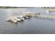 Waterfront property with a private dock featuring boat slips and a covered area, offering convenient access to water activities at 2777 Oak Manor Dr, Mount Pleasant, SC 29466