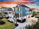 Beautiful teal home with three car garage, large lawn and backyard with waterway view at 2777 Oak Manor Dr, Mount Pleasant, SC 29466