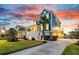 Charming two-story home featuring a spacious front yard, a welcoming porch, and a serene coastal ambiance at 2777 Oak Manor Dr, Mount Pleasant, SC 29466