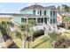 Stunning exterior of a teal home showcasing lush landscaping and inviting staircase at 2777 Oak Manor Dr, Mount Pleasant, SC 29466