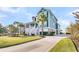 Charming teal two-story home with well-manicured lawn, mature trees, and a spacious driveway at 2777 Oak Manor Dr, Mount Pleasant, SC 29466