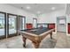 Well-lit game room featuring a billiard table, tiled floor, and access to an outdoor area at 2777 Oak Manor Dr, Mount Pleasant, SC 29466