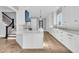Bright, modern kitchen with a center island, sleek white cabinets, and stainless appliances at 2777 Oak Manor Dr, Mount Pleasant, SC 29466