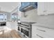 Close up on modern kitchen features including stainless appliances and custom range hood at 2777 Oak Manor Dr, Mount Pleasant, SC 29466